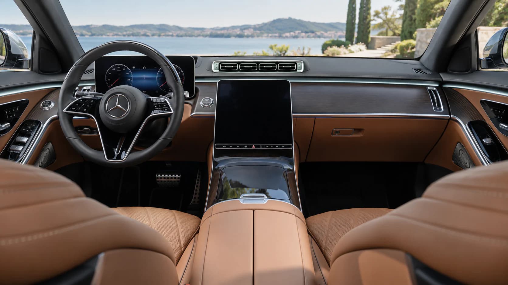 Tan Mercedes-Benz S-Class interior with a portrait central touchscreen